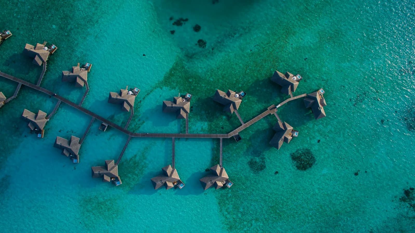 Turquoise lagoon and island villas in the Maldives
