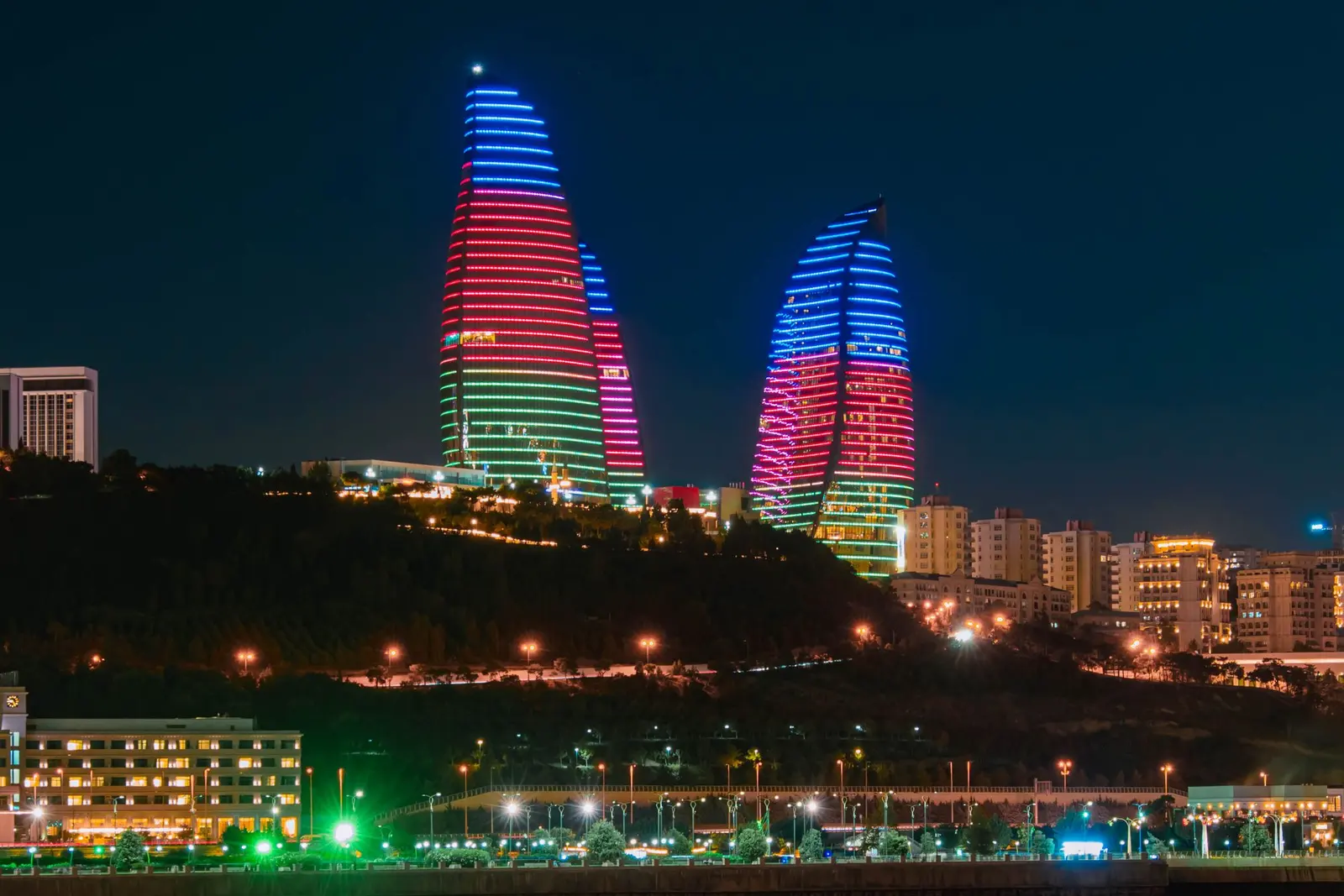 The Flame Towers lit up at night above the Baku waterfront