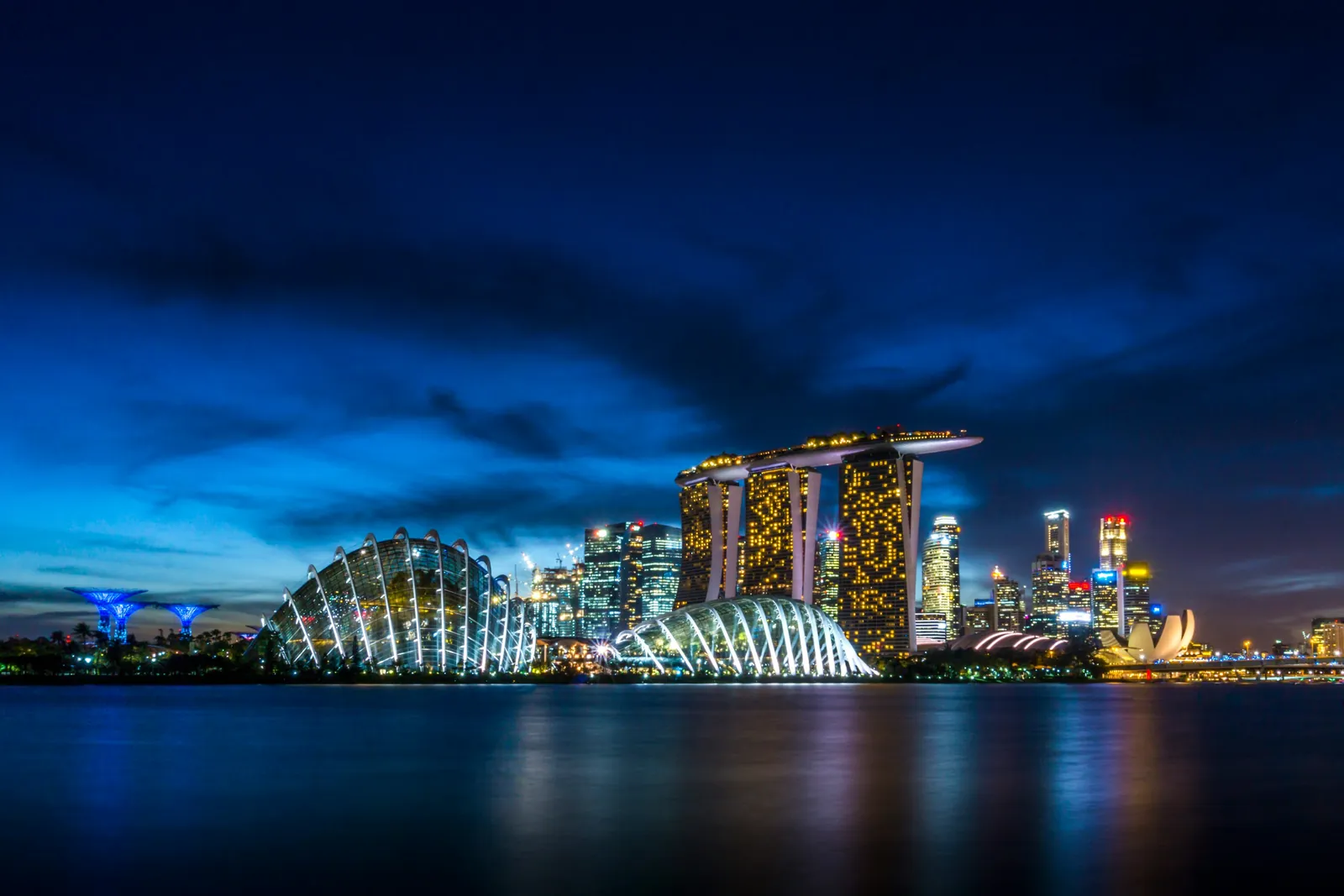 Marina Bay Sands and Gardens by the Bay lit up at night in Singapore