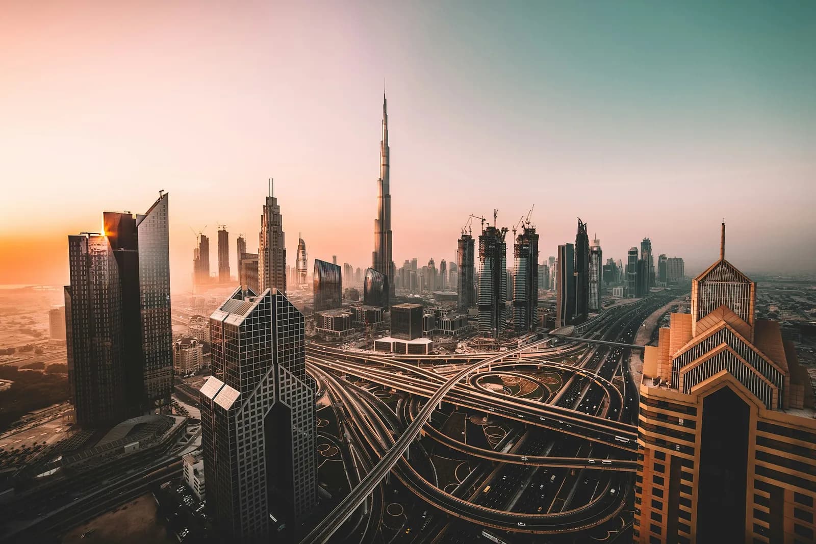 Burj Khalifa and the Downtown Dubai skyline at sunset